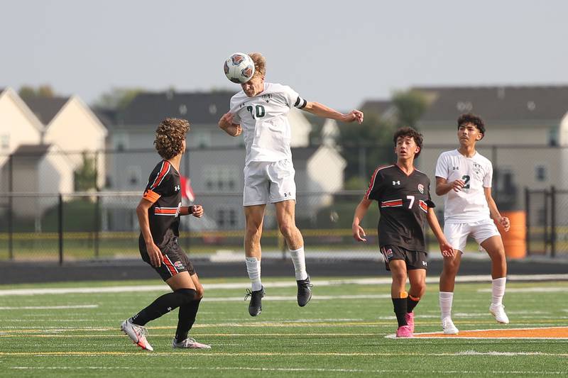 Plainfield Central’s Peyton Johnson heads the pass against Plainfield East on Tuesday, Sept. 19, in Plainfield.