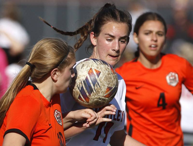 Crystal Lake Central's Brooklynn Carlson tries to control the ball as she battles Huntley's Jaci Laramie during a Fox Valley Conference soccer game on Tuesday, April 9, 2024, at Crystal Lake Central High School.