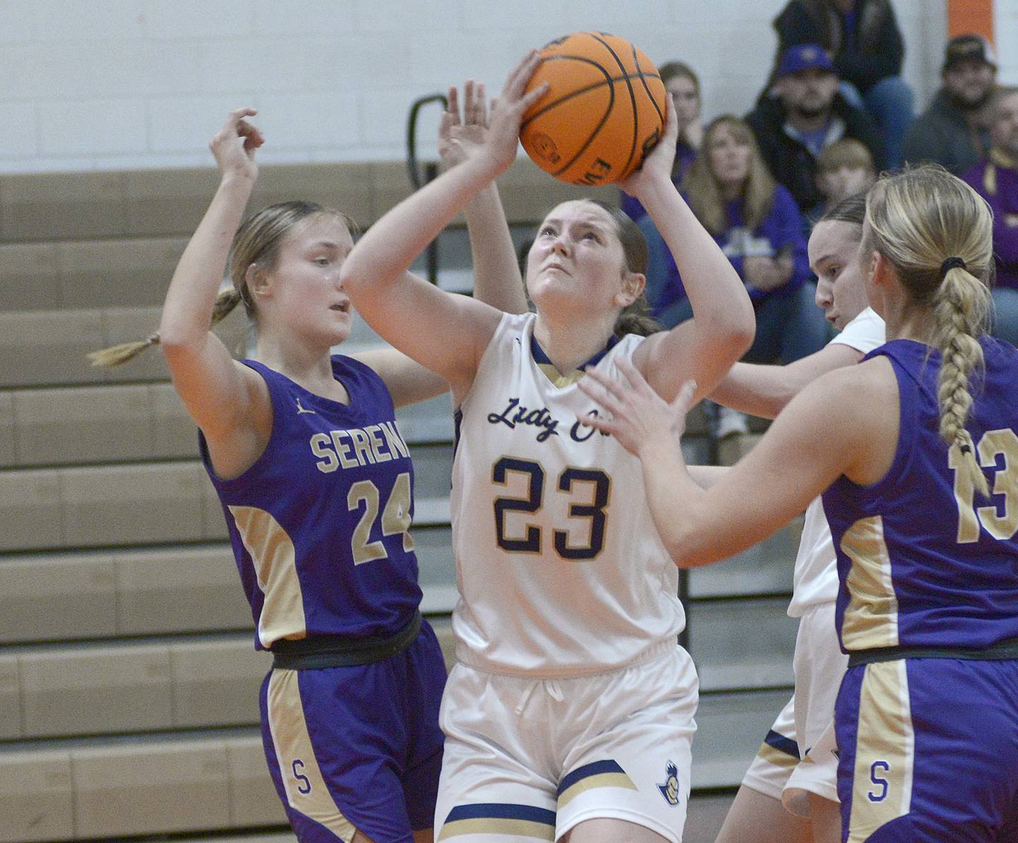 Marquette’s Kelsey Cuchra gets between Serena’s Anna Hjerpe (24) and Brynley Glade during the second quarter of Saturday's championship of the Falcon-Irish Thanksgiving Tournament at Flanagan-Cornell High School.