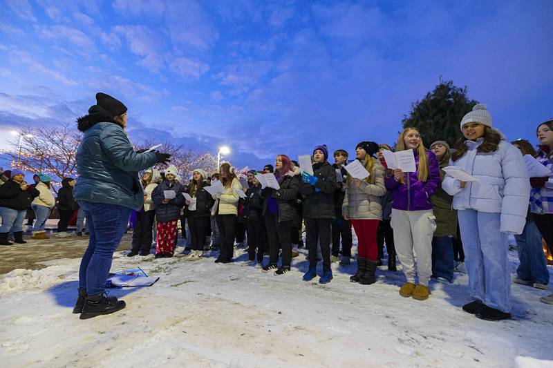 The Reagan Middle School choir entertains the crowd Friday, Dec. 5, 2025, before the tree lighting in Dixon.