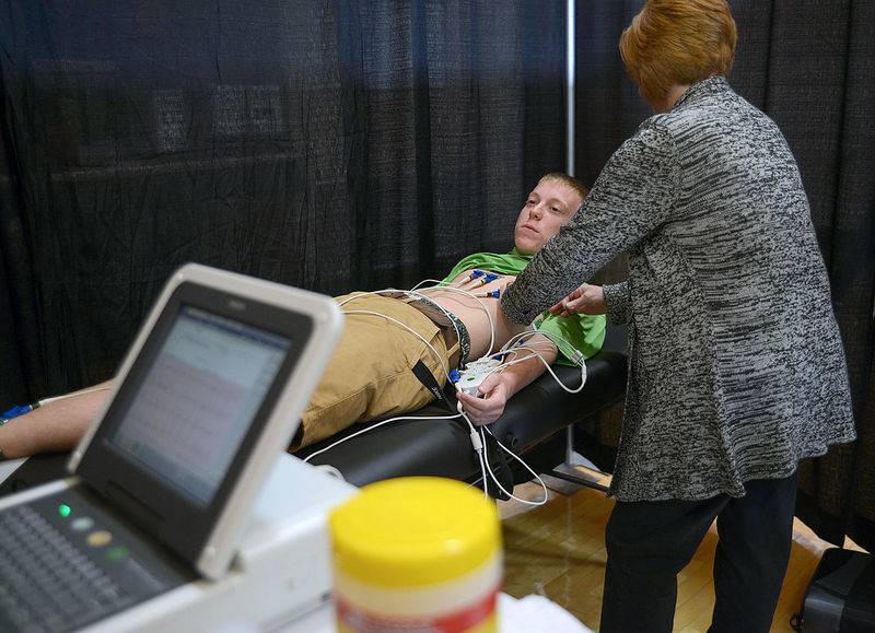 Marquette Academy junior Kohl Babcock, who participates in high school football, track and hockey, has his heart checked by a technicians from Morris Hospital during free heart screenings at a past Rhythm of Our Youth program.