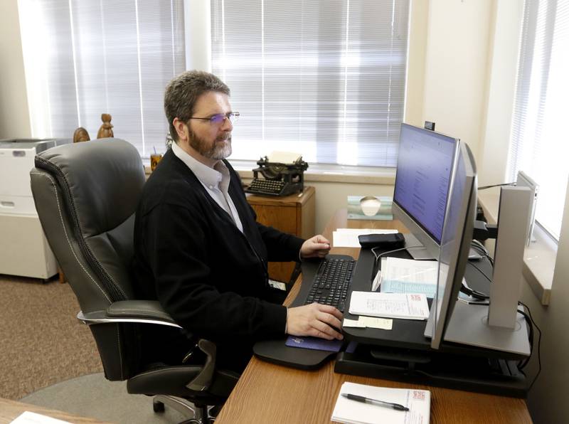 McHenry County Clerk Joe Tirio works in his office the morning of Thursday, Jan. 20, 2022, in Woodstock, the day after the Illinois Supreme Court heard oral arguments in McHenry Township's court case against the Clerk's Office over the township's 2020 abolition attempt.