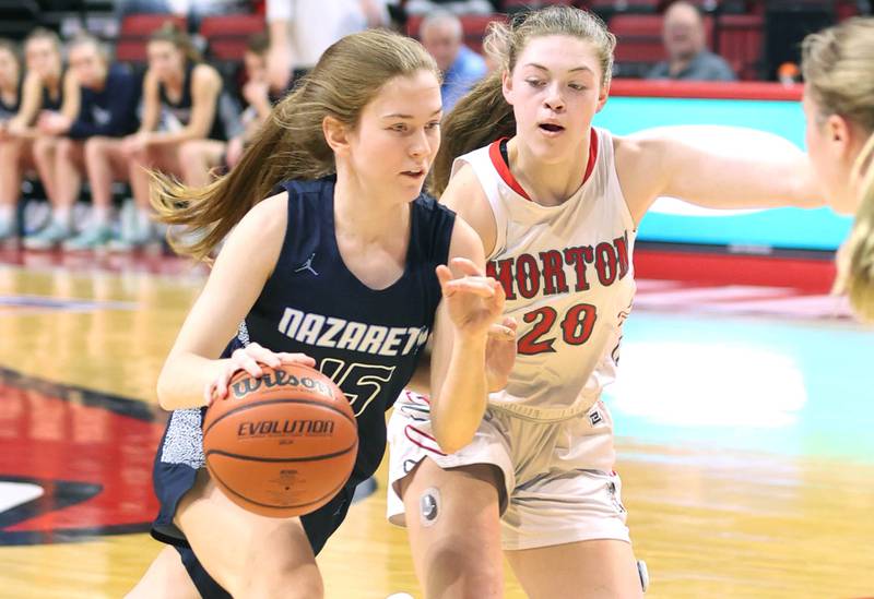 Nazareth's Mary Bridget Wilson drives by Morton's Isabella Hutchinson during their Class 3A state semifinal game Friday, March 4, 2022, in Redbird Arena at Illinois State University in Normal.