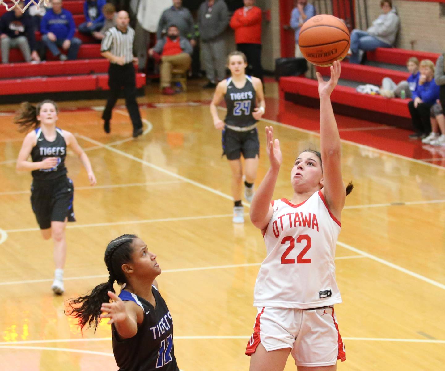 Ottawa's Marlie Orlandi (22) breezes in for a lay-up as Princeton's Mariah Hobson (left) backs off in a game at Kingman Gymnasium two seasons ago.