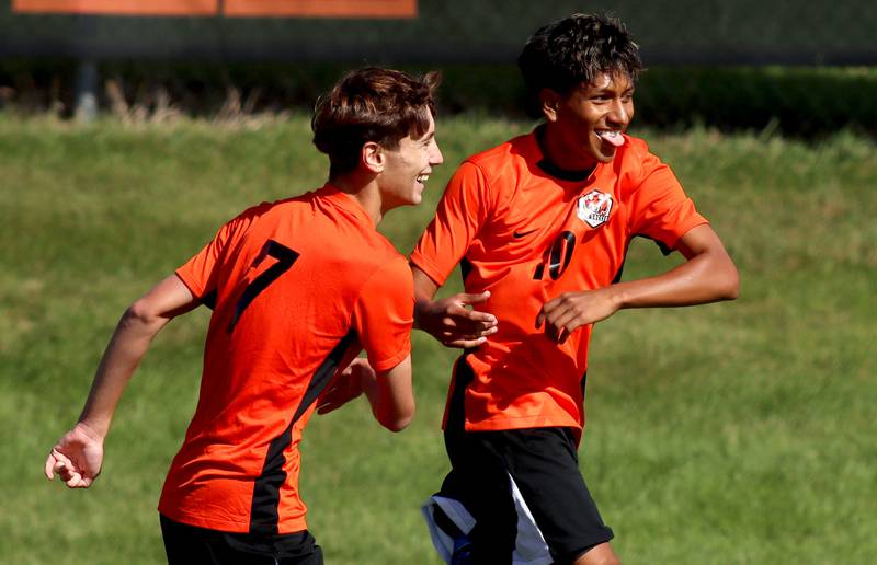 Crystal Lake Central’s Nathan Gray, left, is greeted by Ulisses Mateos after the Tigers’ first goal against Harvard in varsity boys soccer at Crystal Lake Central High School in Crystal Lake on Saturday, Sept. 6, 2025.