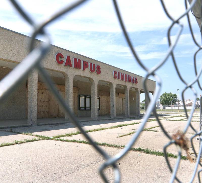 The former Campus Cinemas building in DeKalb remains empty and fenced off Thursday August 13, 2020.