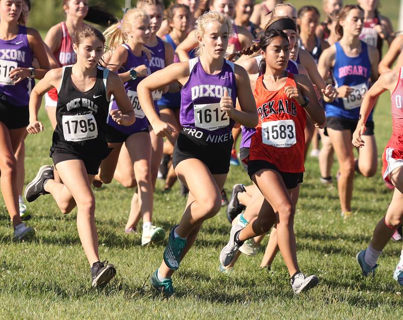 Dixon's Emma Smith gets out fast in the girls race Tuesday, Aug. 30, 2022, during the Sycamore Cross Country Invitational at Kishwaukee College in Malta.