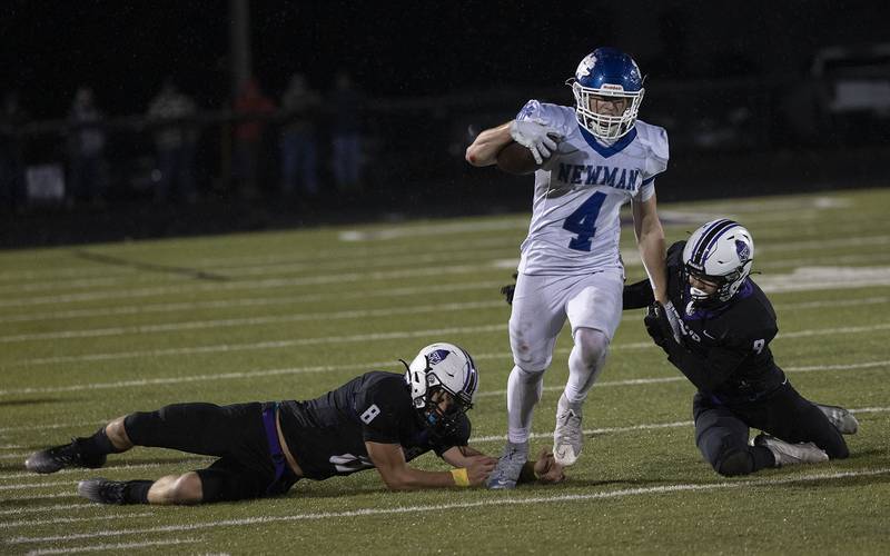 Newman’s Matthew Blackert gets by a pair of El Paso tacklers Saturday, Nov. 8, 2025.