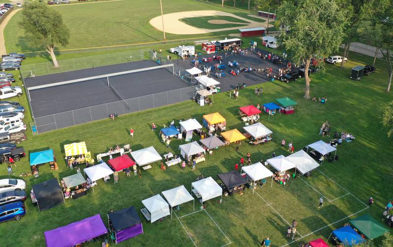 An aerial view of vendor booths during the Friday Night Market's event on Friday, Aug. 18, 2023 at Kirby Park in Spring Valley. These well-loved markets, traditionally held on the third Friday of each month, moved from the downtown location in the mini park to the captivating and spacious Kirby Park. Fireworks concluded the event. Organizers hope to reenergize its downtown through the markets through the GROW Spring Valley group.