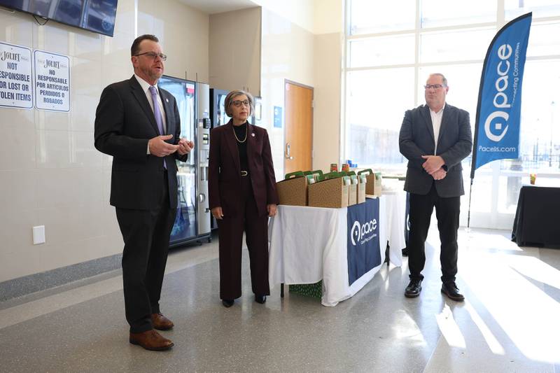 Illinois State Representative Larry Walsh Jr, left, speaks as Pace Executive Director Melinda Metzger and Chairman Nick Kwasneski listen at the official launch of the Pace VanGo vanpool reservation-based round-trip service on Thursday, Dec. 4, 2025 in Joliet.