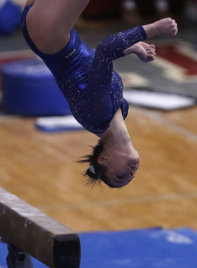 Geneva's cReese Lackey ompetes in the preliminary round of the balance beam on Friday, Feb. 21, 2025, during the IHSA Girls State Final Gymnastics Meet at Palatine High School.