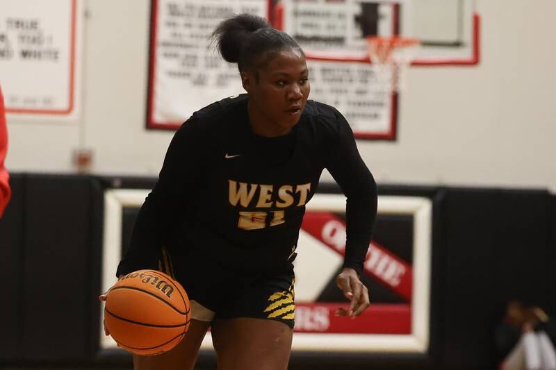 Joliet West’s Jada Thompson works the ball against Bolingbrook on Thursday, Jan 23, 2025 in Bolingbrook.