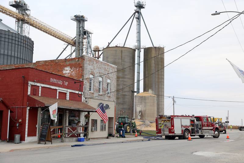 Emergency personnel close East Main Street in Martinton after a concrete grain bin collapsed on Wednesday, Oct. 15, 2025, at the Donovan Farmers Co-Op Elevator.