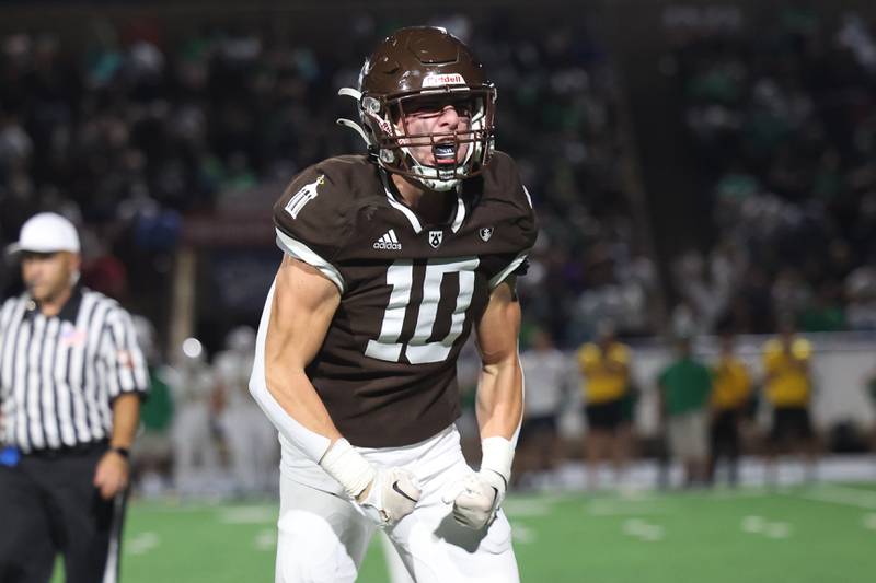 Joliet Catholic’s Griffin Alessio celebrates a 3rd down stop against Providence on Friday, Sept. 1, 2023 Joliet Memorial Stadium.