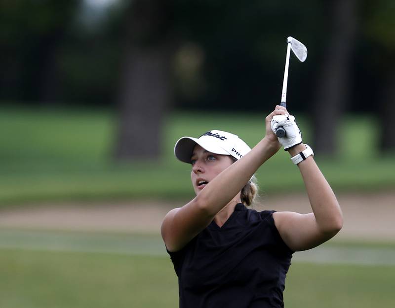McHenry’s Madison Donovan watches her tee shot on the16th hole during the Fox Valley Conference Girls Golf Tournament Wednesday, Sept. 20, 2023, at Crystal Woods Golf Club in Woodstock.