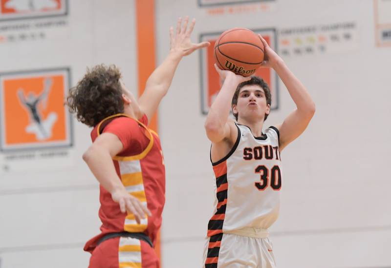 Wheaton-Warrenville South's Luca Carbonaro (30) sinks a 3 point shot against Batavia during a game in Wheaton on Saturday, January 6, 2024.