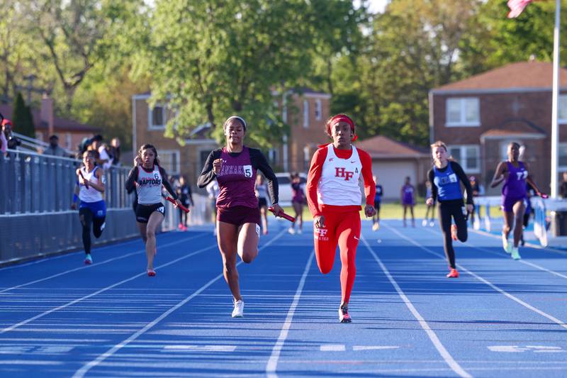 Kankakee's Jasiah Hawkins falls into second behind Homewood-Flossmoor's Aniya Mullins in the 4x100 relay during the IHSA Class 3A Chicago Heights Girls Track and Field Sectional at Bloom High School on Wednesday, May 13, 2026.