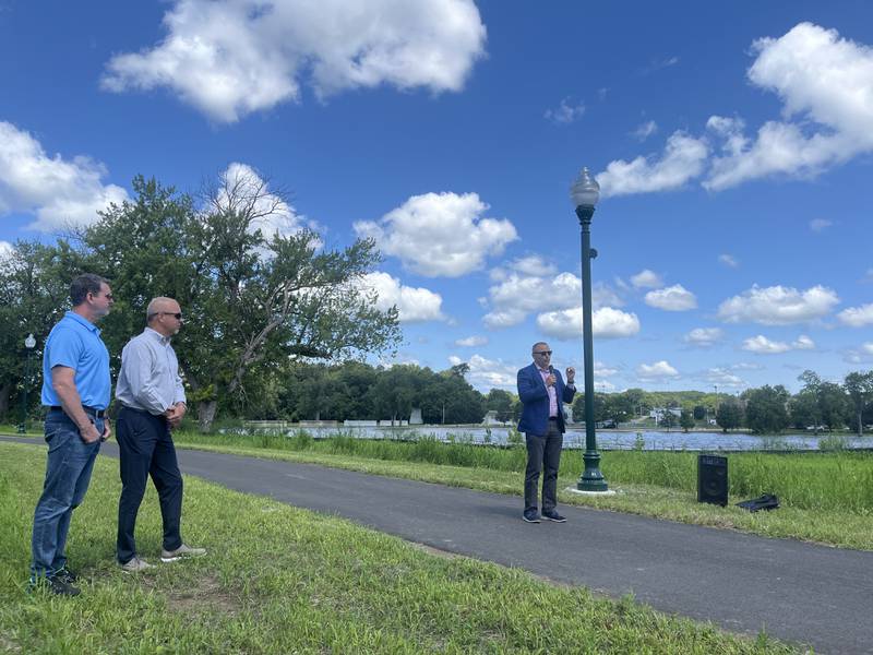 Dixon City Manager Danny Langloss talks to the crowd Thursday, June 18, 2024, at a ribbon cutting for the completed ITEP multi-use path. Next, the city will extend the path by constructing a pedestrian bridge across the river using the old Illinois Central Railroad piers.