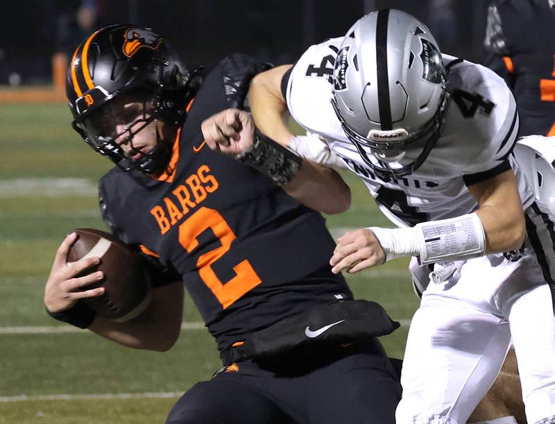 DeKalb's Cole Latimer is knocked out of bounds by Kaneland's Brady Alstott during their game Friday, Sept. 12, 2025, at DeKalb High School.