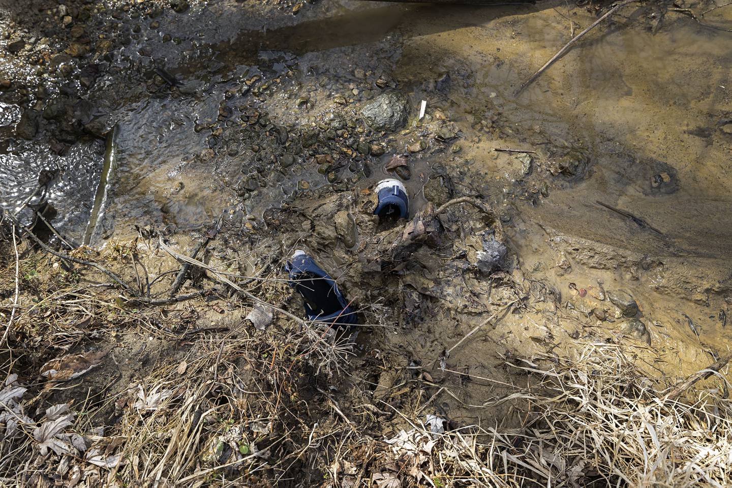 Shoes sinking into the muck.