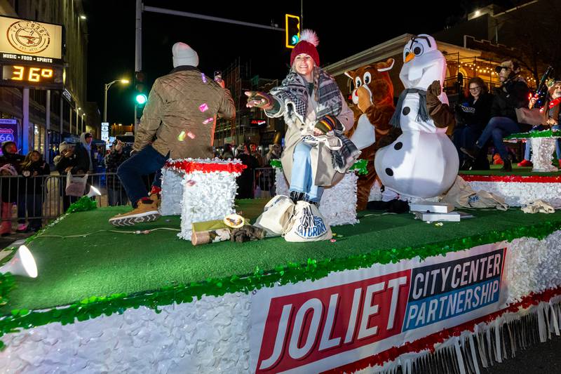 The Joliet City Center Partnership float delights spectators during the Light Up the Holidays Parade in Downtown Joliet on Nov. 28, 2025.