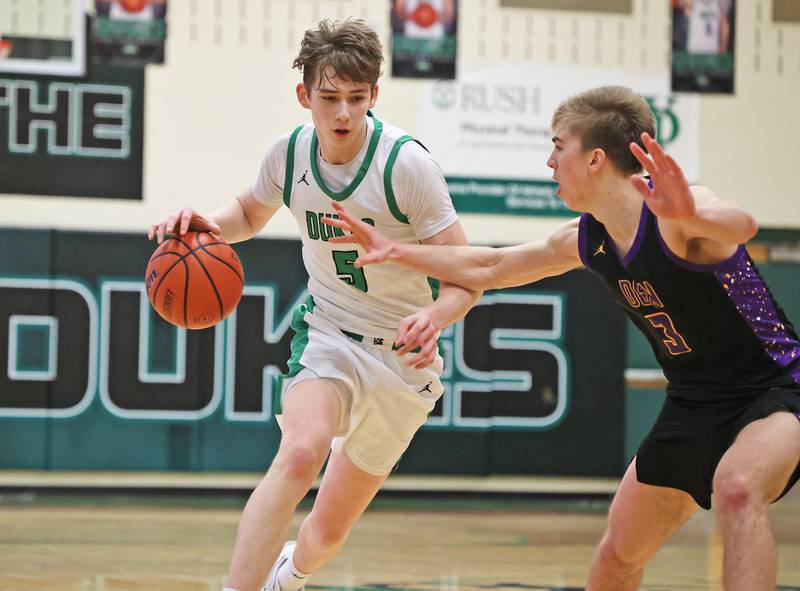 York’s Kyle Waltz (5) drives the lane against Downers Grove North during a boys varsity basketball game on Saturday, Feb. 10, 2024 in Elmhurst, IL.