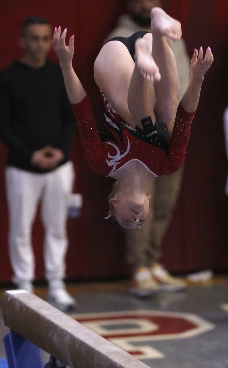 Palatine’s Jolee Waddington competes in the preliminary round of the balance beam on Friday, Feb. 21, 2025, during the IHSA Girls State Final Gymnastics Meet at Palatine High School.