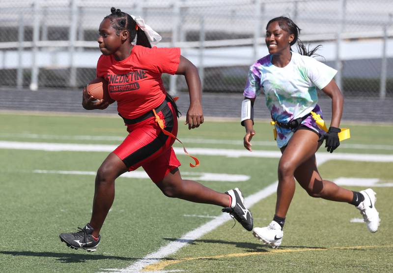 A player finds a hole in the defense Wednesday, Aug. 20, 2025, during the first practice of the DeKalb High School flag football team. The squad is preparing for their inaugural season.