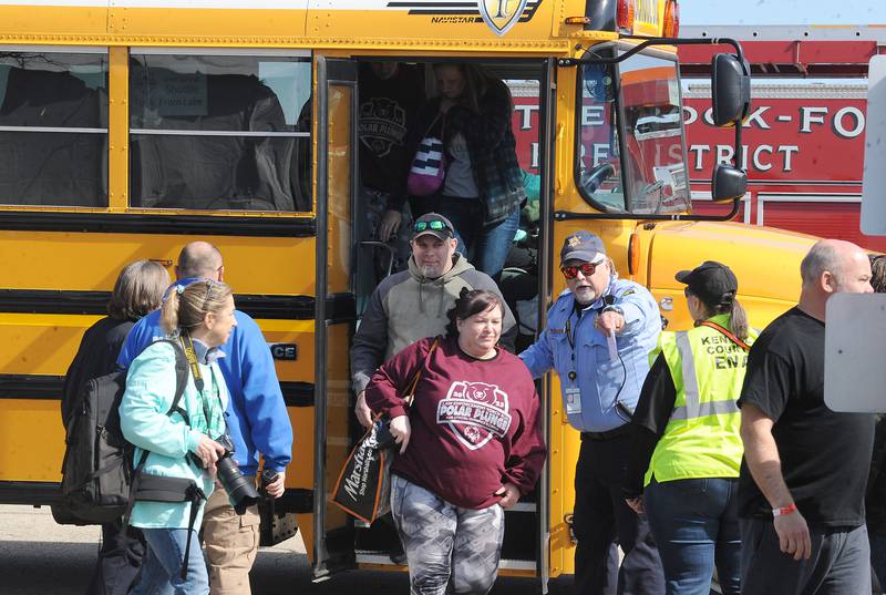 Plungers get off the shuttle bus during the annual Polar Plunge to support Special Olympics Illinois at Siver Springs State Park's Loon Lake on Sunday, Mar. 5, 2023.