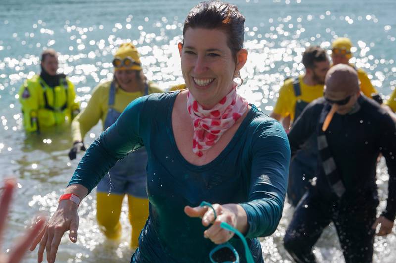 Erin Waltmire of Oswego smiles after participating in the polar plunge with a number of Kendall County Sheriffs officers during the polar plunge for special olympics at Silver Springs State Park in Yorkville on Sunday, Mar 3, 2024.
