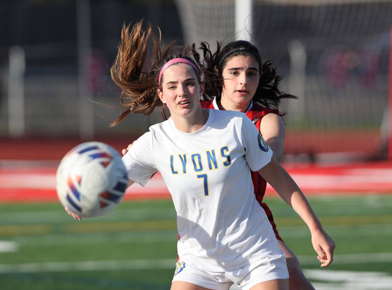 Lyons Township's Carol Mortonson (7) and Hinsdale Central's Adriana Giannini (23) watch the ball during the girls varsity soccer match between Lyons Township and Hinsdale Central high schools in Hinsdale on Tuesday, April 18, 2023.