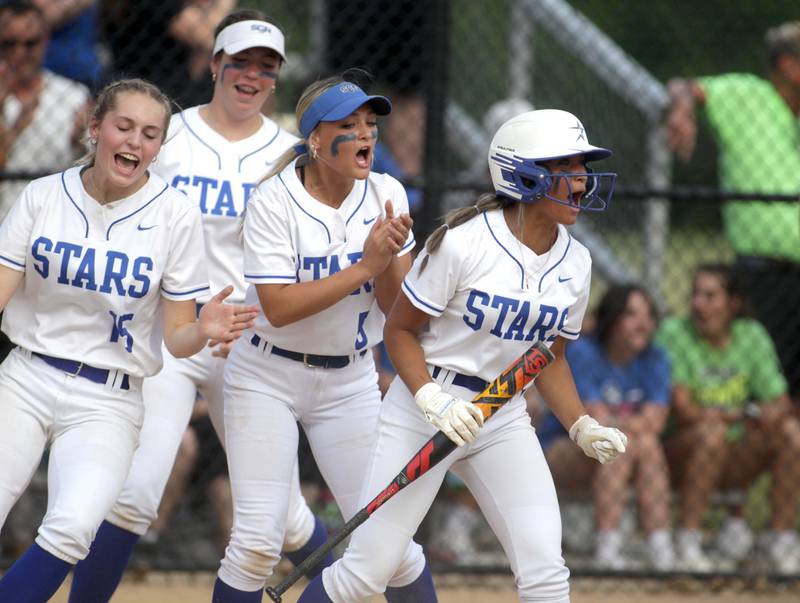 St. Charles North players celebrate a homerun by teammate Sophia Olman during a Class 4A St. Charles North Sectional semifinal against Fremd on Tuesday, May 30, 2023.