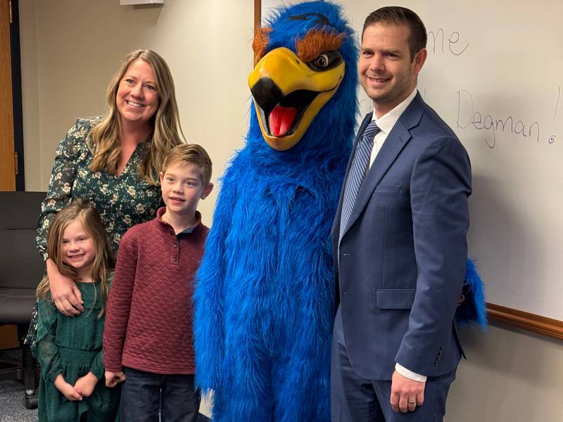The Batavia School District 101 has named Sean Degman as the next principal of Hoover-Wood Elementary School. Pictured, Degman stands with his family and the HWS mascot, "Howie the Hawk."