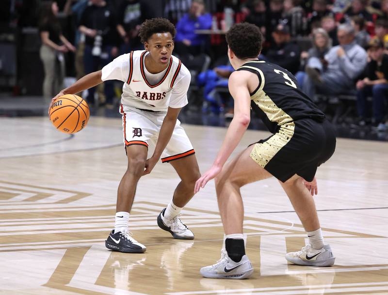 DeKalb's Bryan Miller works against Sycamore's Marcus Johnson Friday, Jan. 30, 2026, during the FNBO Challenge at the Convocation Center at Northern Illinois University in DeKalb.