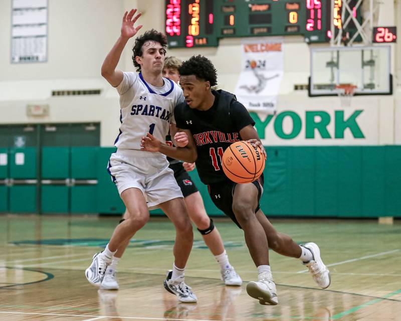 Yorkville's Christian Harrell (11) drives down the lane during their Jack Tosh Holiday Classic basketball tournament game between St Francis at Yorkville Thursday Dec 26, 2024 in Elmhurst.