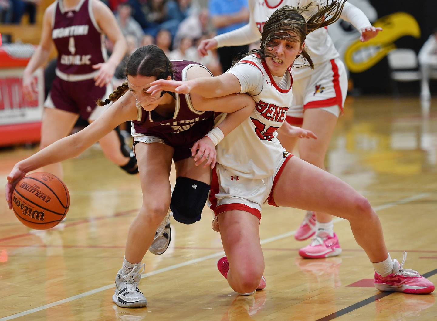 Montini's Nicolette Kerstein and Benet's Emilia Sularski (right) battle for a loose ball during a game on Feb. 5, 2024 at Benet Academy in Lisle.