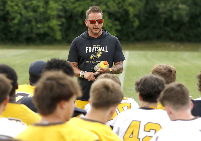 Jacobs Head Coach Brian Zimmerman.talks to his team before the start of football practice on Tuesday, August 15, 2025, at Jacobs High School in Algonquin.