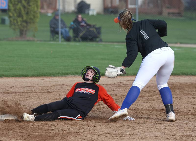 Genoa-Kingston’s Elizabeth Davis tags out Winnebago’s Kyla Warkentien attempting to steal during their game Monday, April 21, 2025, at Genoa-Kingston High School.
