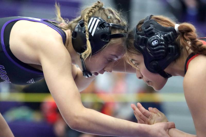 Huntley’s Donna Garcia, right, faces off with Hampshire’s Amelia Nidelea-Polani at 115 pounds in IHSA Regional wrestling semifinal action on Saturday, Feb. 1, 2025, at  Hampshire High School  in Hampshire.