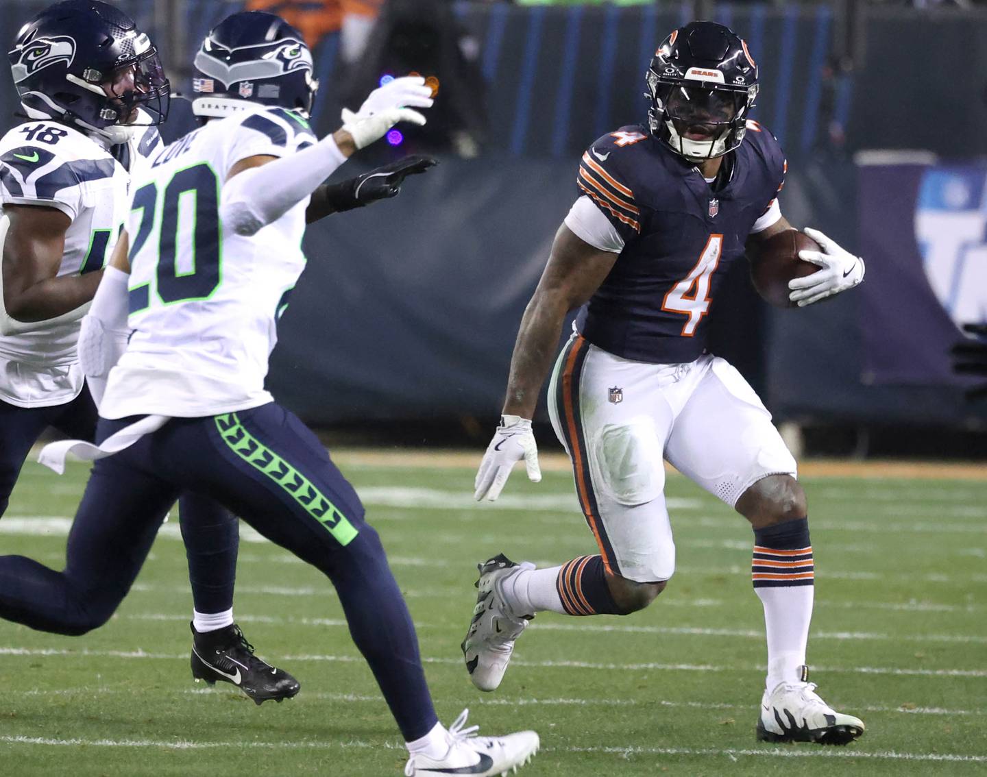 Chicago Bears running back D'Andre Swift tries to get outside the Seattle Seahawks defense during their game Sunday, Dec. 26, 2024, at Soldier Field in Chicago.