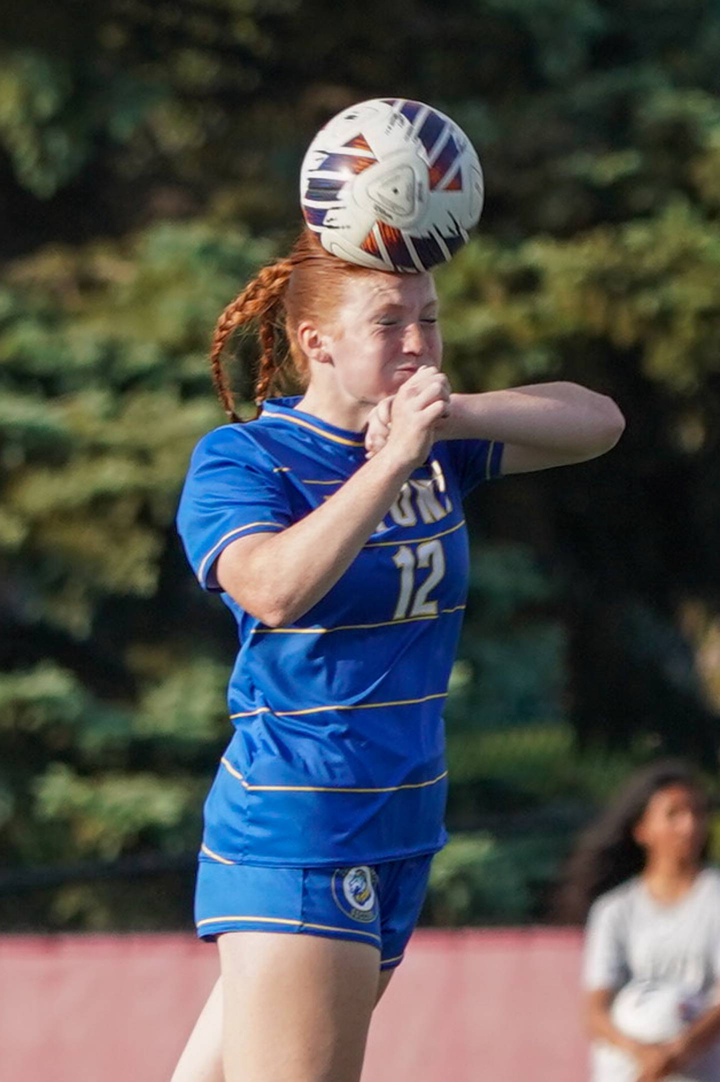 Lyons’ Izzi Wirtz (12) goes up for a header against Hinsdale Central during a Class 3A Hinsdale Central Sectional semifinal soccer match at Hinsdale Central High School in Hinsdale on Tuesday, May 21, 2024.