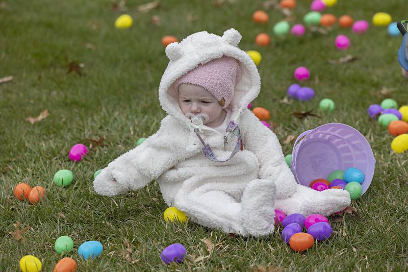 Arzillya Burtlow, 1, of Rock Falls plays among the eggs at Coloma Park District’s egg hunt in Rock Falls Saturday, April 1, 2023. Along with prizes from the eggs, each child was gifted a bag with three books, a stuffed animal and information on a parent education group called Parents as Teachers. The Regional Office of Education 47 and Rock Falls Rotary helped sponsor the event.