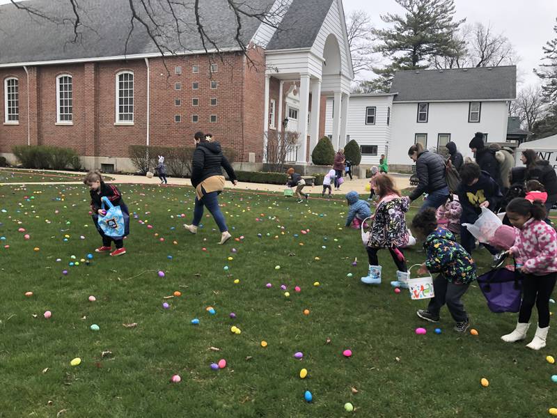 Attendees find eggs during the egg hunt at St. Peter's Church in Spring Grove March 30, 2024.
