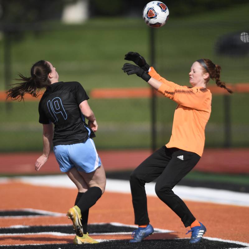 John Starks/jstarks@dailyherald.com
Wheaton Warrenville South goalkeeper Caroline Spayth deflects a shot by St. Charles North’s Rian Spaulding in the St. Charles East girls soccer sectional semifinal game on Tuesday, May 24, 2022.