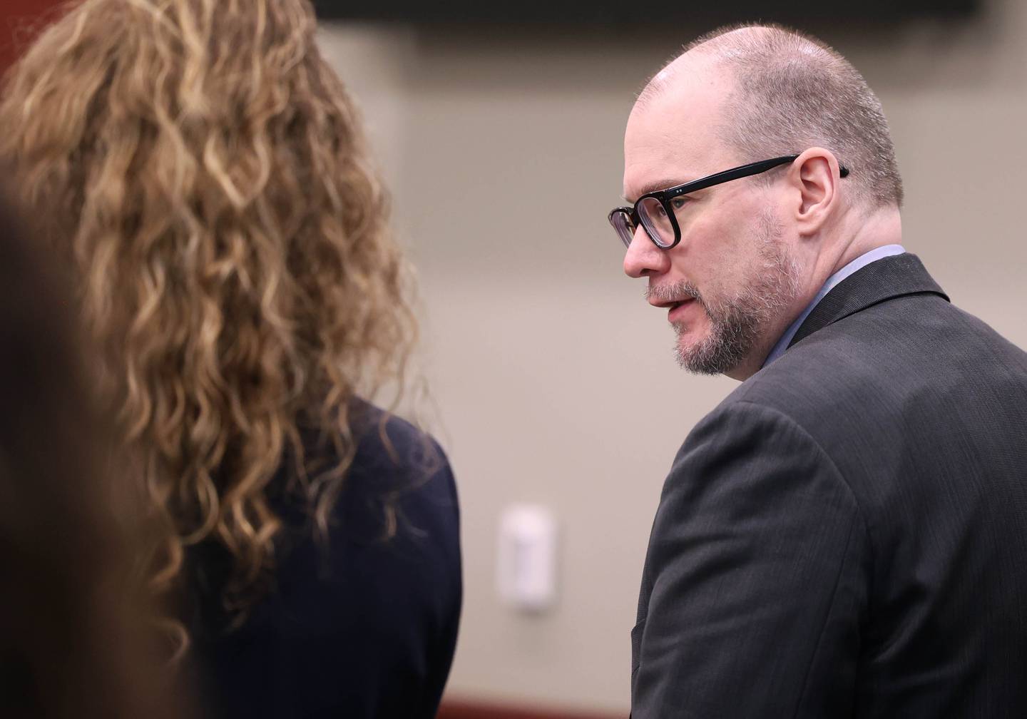Jonathan Hurst (right) talks to Emma Franklin, one of his lawyers, Monday, Jan. 27, 2025, during Day 3 of his trial at the DeKalb County Courthouse in Sycamore. Hurst is charged in the 2016 killings of elderly mother and son Patricia and Robert Wilson.