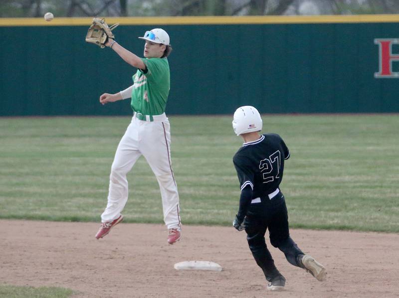 L-P's Jack Jereb makes a high catch on a attempt to tag out Kaneland's Tom Thill at second base on Thursday, April 11, 2024 at Huby Sarver Field in La Salle.