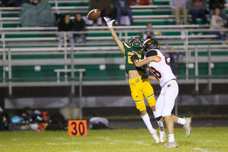 Crystal Lake Central's Graham Reckamp prevents Crystal Lake South's Josh Saldana from making the catch on Friday Sept.30,2022 in Crystal Lake.