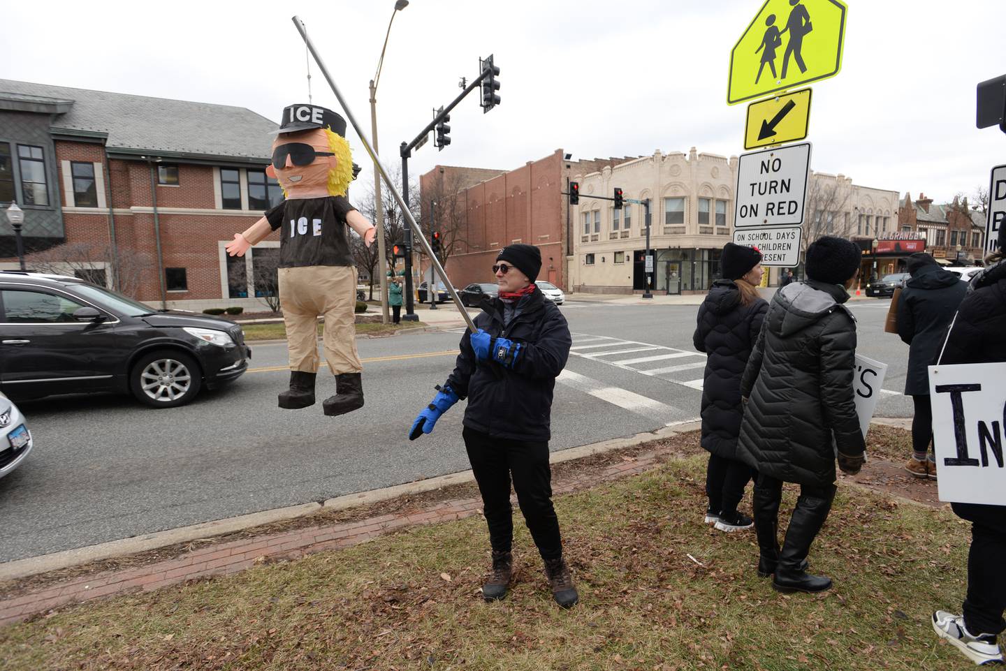 A protestors hangs an ICE agent in effigy Sunday during a demonstration Sunday against ICE and the Trump administration in downtown La Grange.