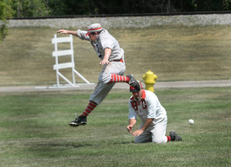 Oregon Ganymede's Tom Lesniak jumps over a Bay City Independent player as he runs to the third base during the World Tournament of Historic Base Ball held at the Henry Ford Museum's Greenfield Village on Saturday, Aug. 9, 2025.
