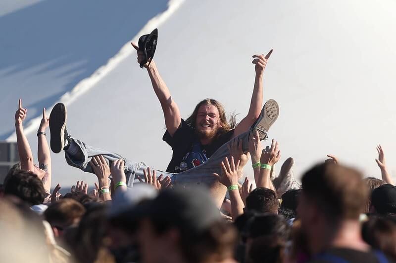 A festival goer crowd surfs during Hot Mullingan's set at Riot Fest on Friday, Sept. 20, 2024 in Chicago.